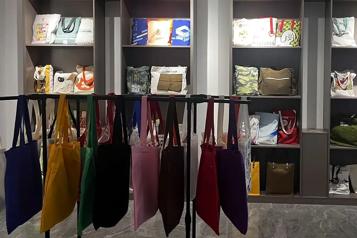 Solid-color tote bag samples arranged for appearance and construction review.