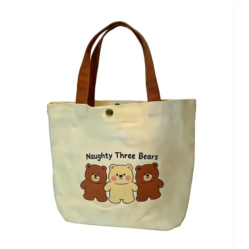 Natural canvas tote bag with brown handles and a three-bear print.
