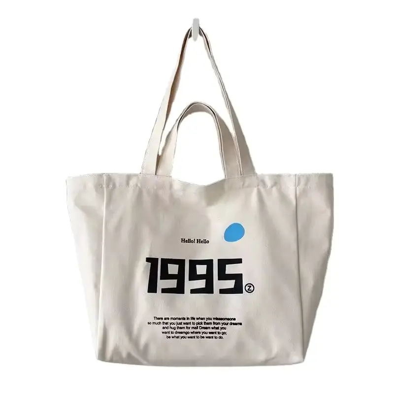 Large natural cotton shopping tote with short and shoulder-length handles.
