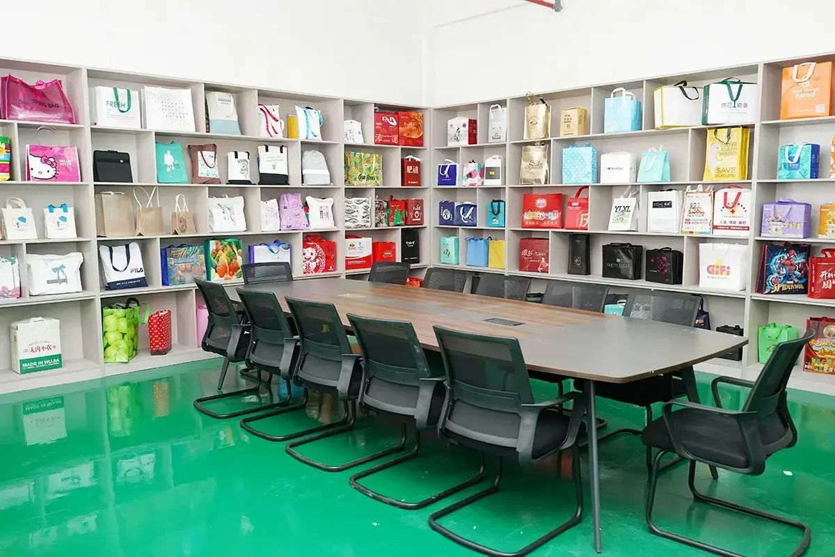 Tote bag meeting room with finished custom samples displayed on the walls.