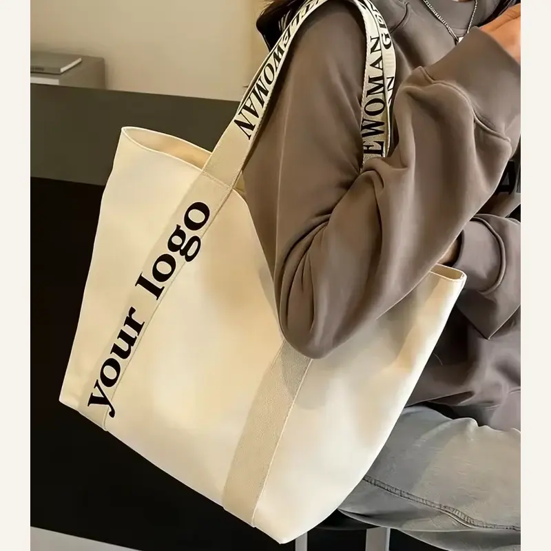 White 12 oz canvas tote shown from the side in use