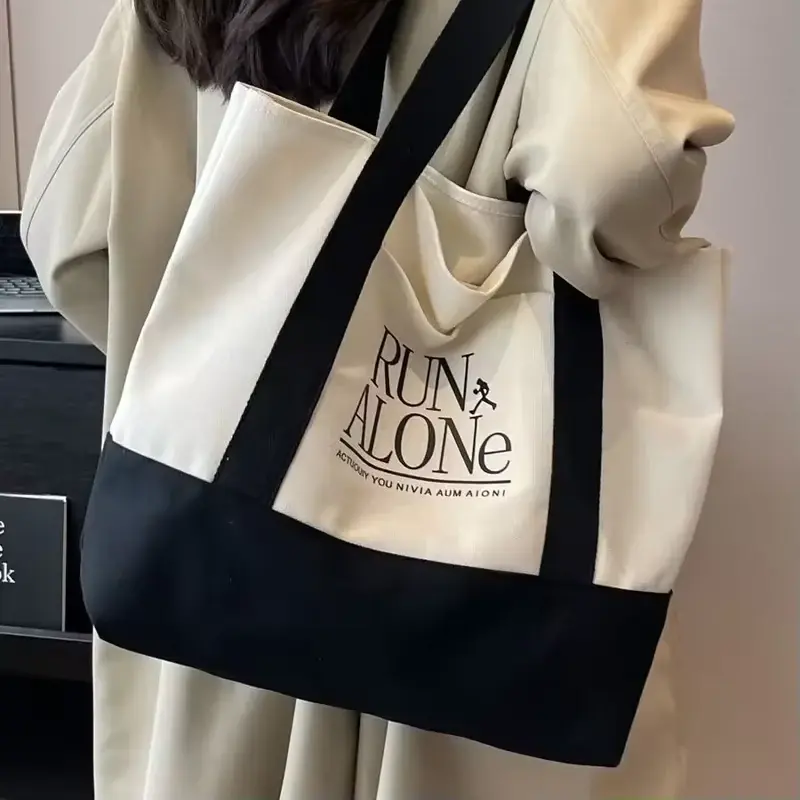 Natural gusseted canvas tote with a reinforced black base