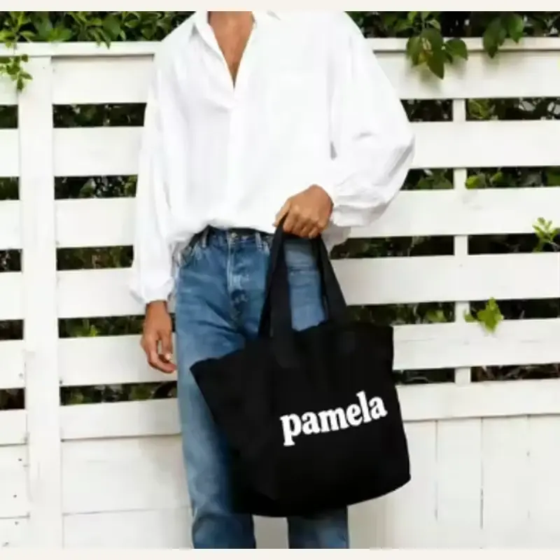 Black 12 oz heavyweight canvas tote carried by short handles