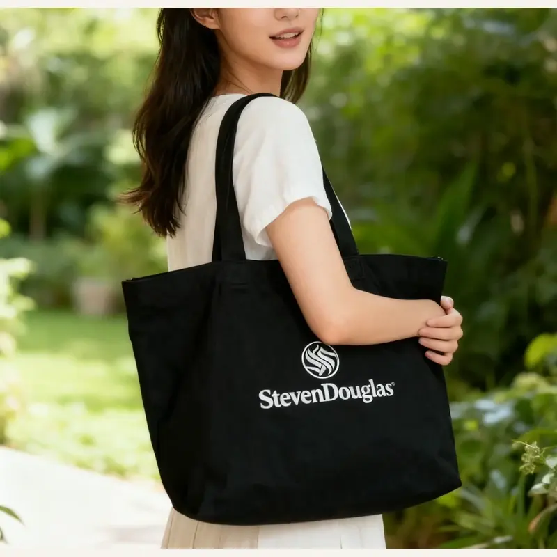 Black heavyweight canvas tote shown at full carrying size