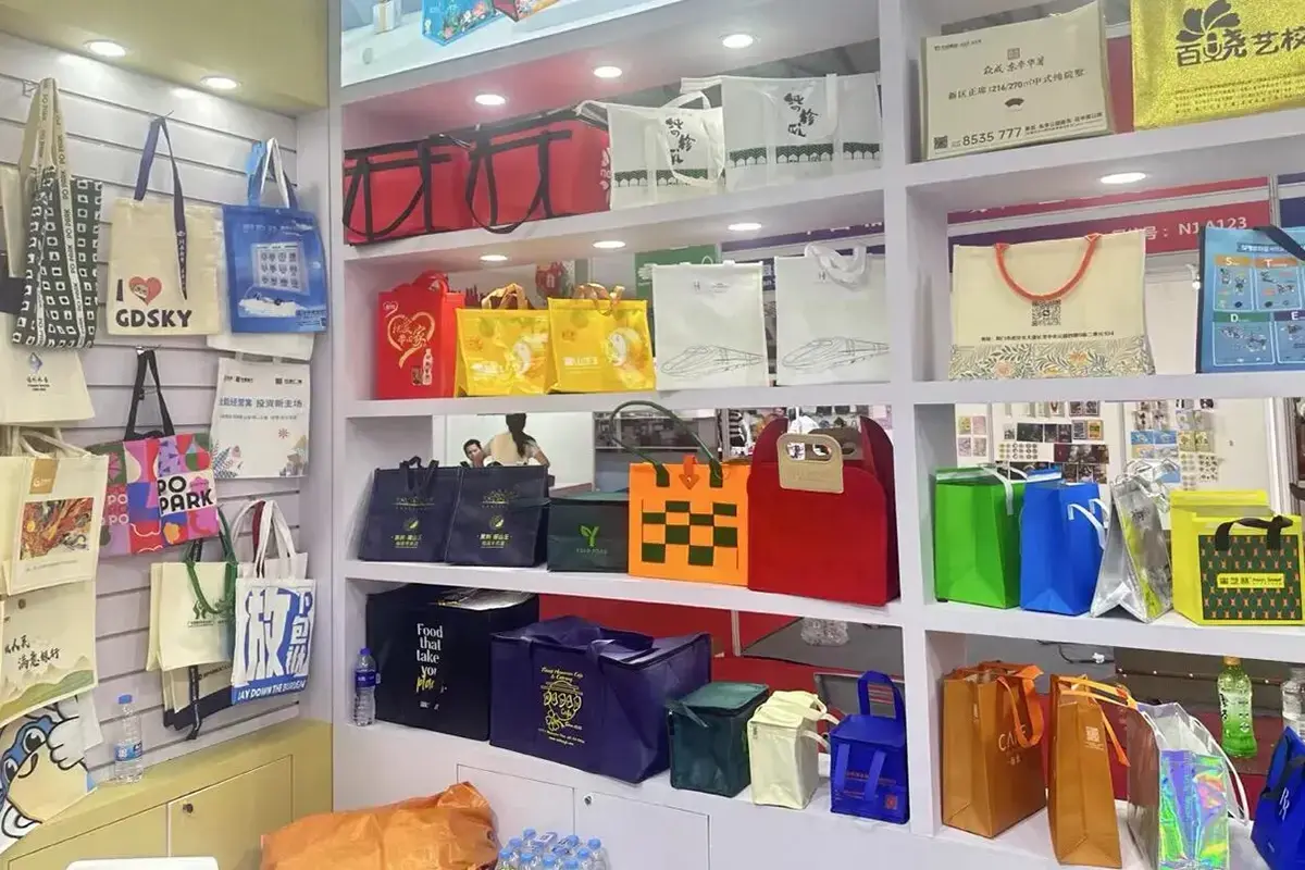 Heavy canvas tote samples displayed in the factory showroom