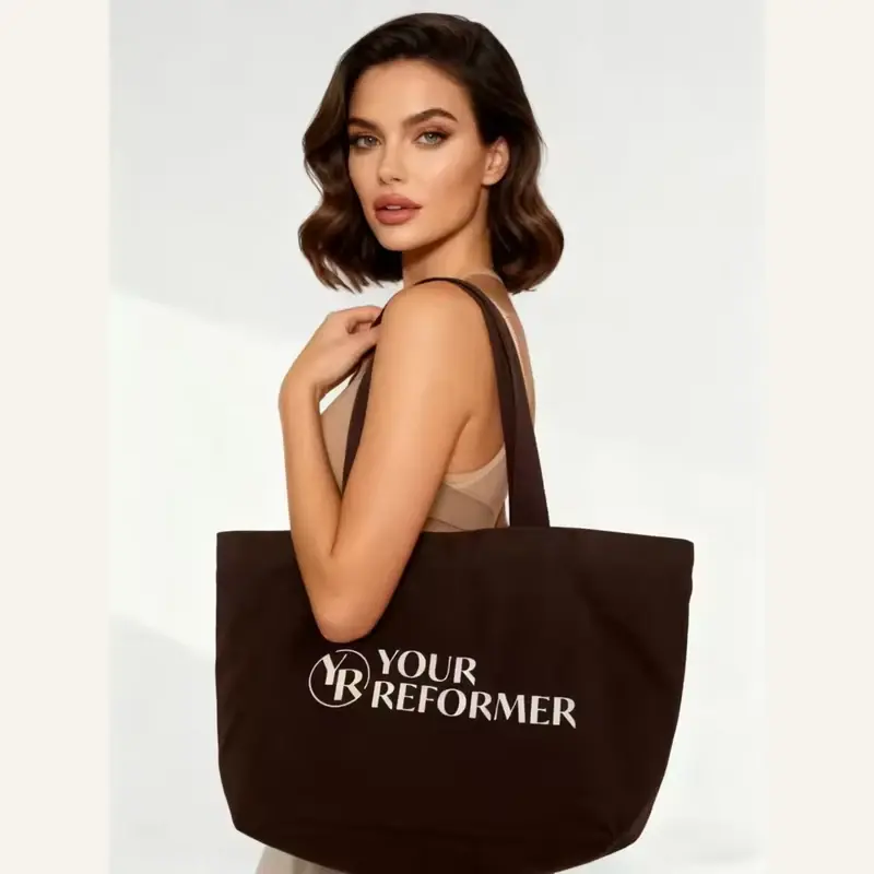 Brown heavyweight canvas tote with a wide structured base