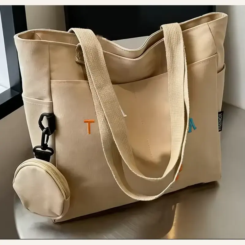 Tan heavyweight canvas tote with top zipper and matching pouch