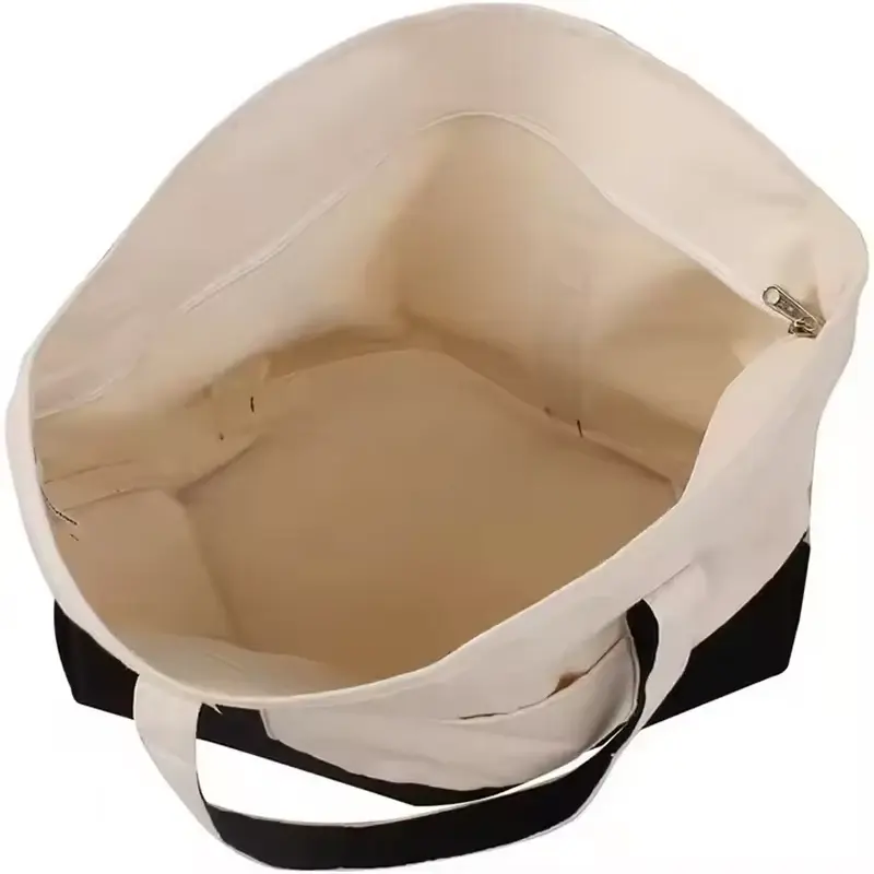 Open canvas tote showing a wide inner slip pocket