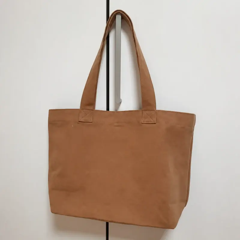 Brown gusseted canvas tote bag with wide side panels