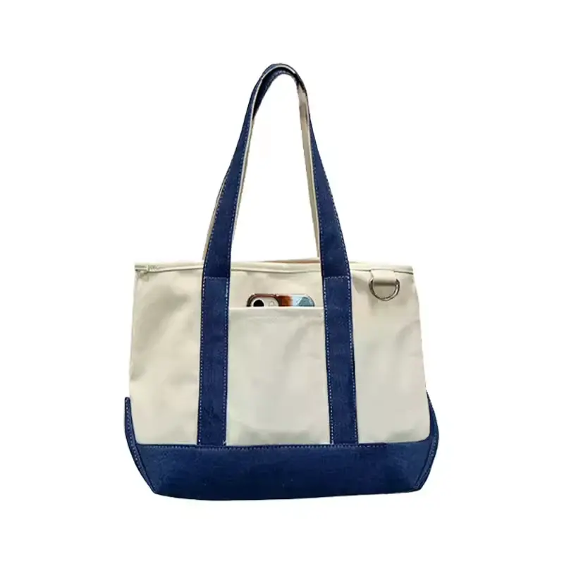 Natural canvas tote with blue webbing handles and base