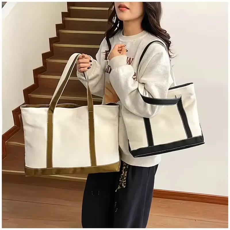 Model carrying canvas totes with contrasting webbing handles