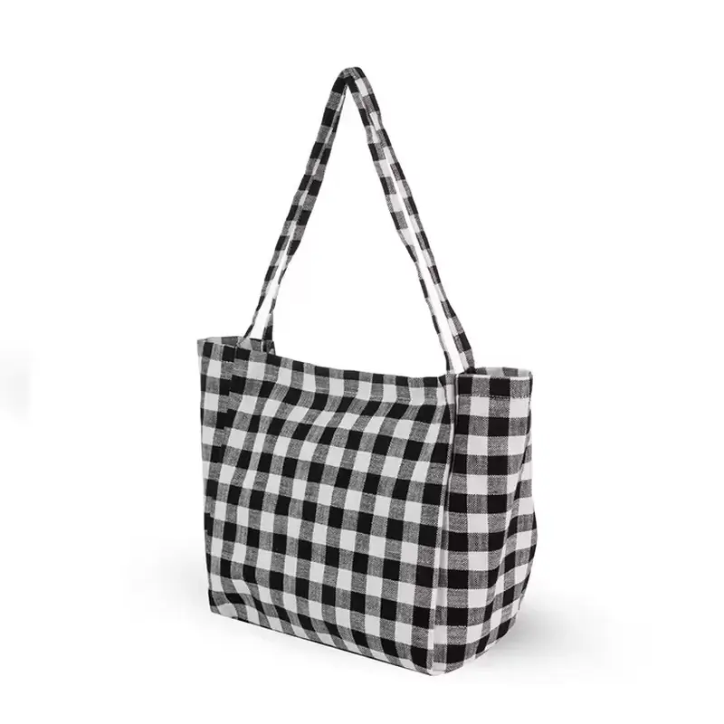 Black and white checkered canvas tote with a closed top zipper