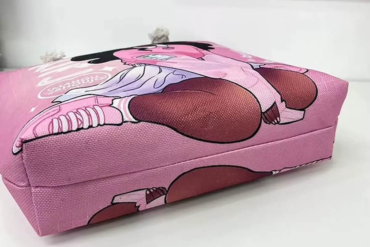 Pink printed zipper tote laid flat to check fold and body shape