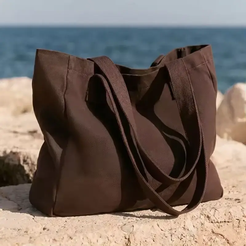 Heavy brown canvas tote bag with reinforced body panels
