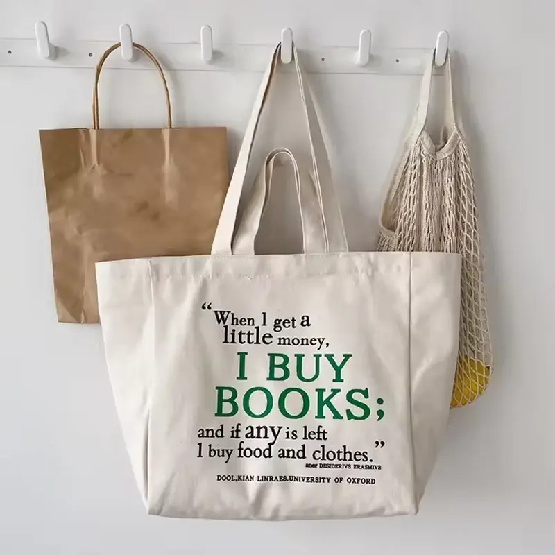 Natural cotton tote with printed book lettering and long handles