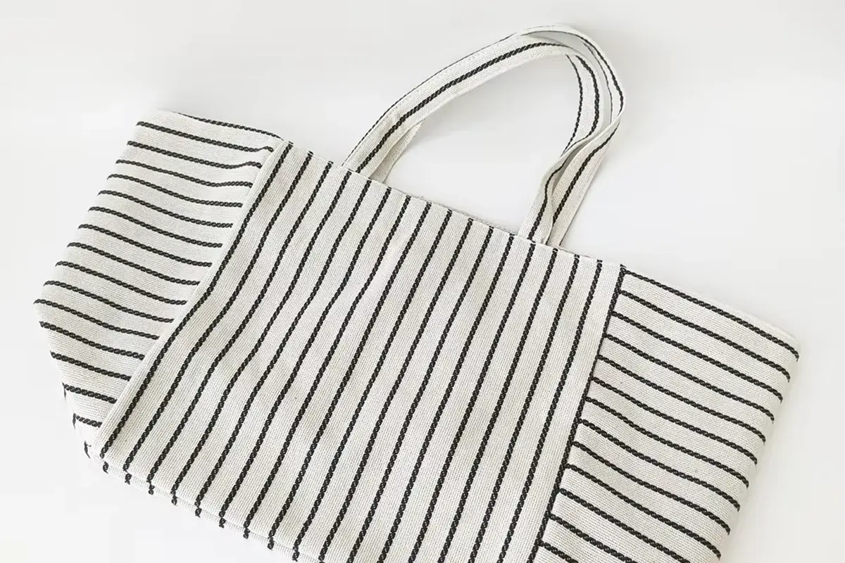 Striped cotton shopping tote showing the opening and stitched handles