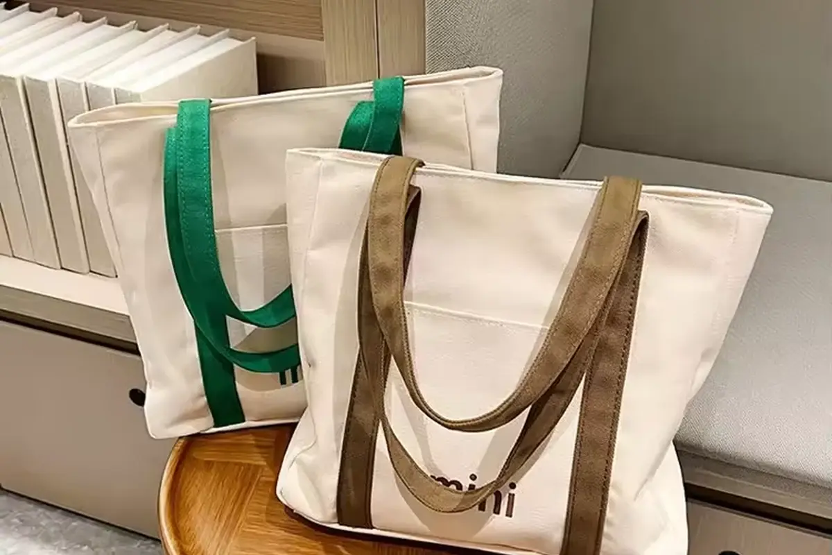 Natural cotton tote group showing long handles arranged for packing