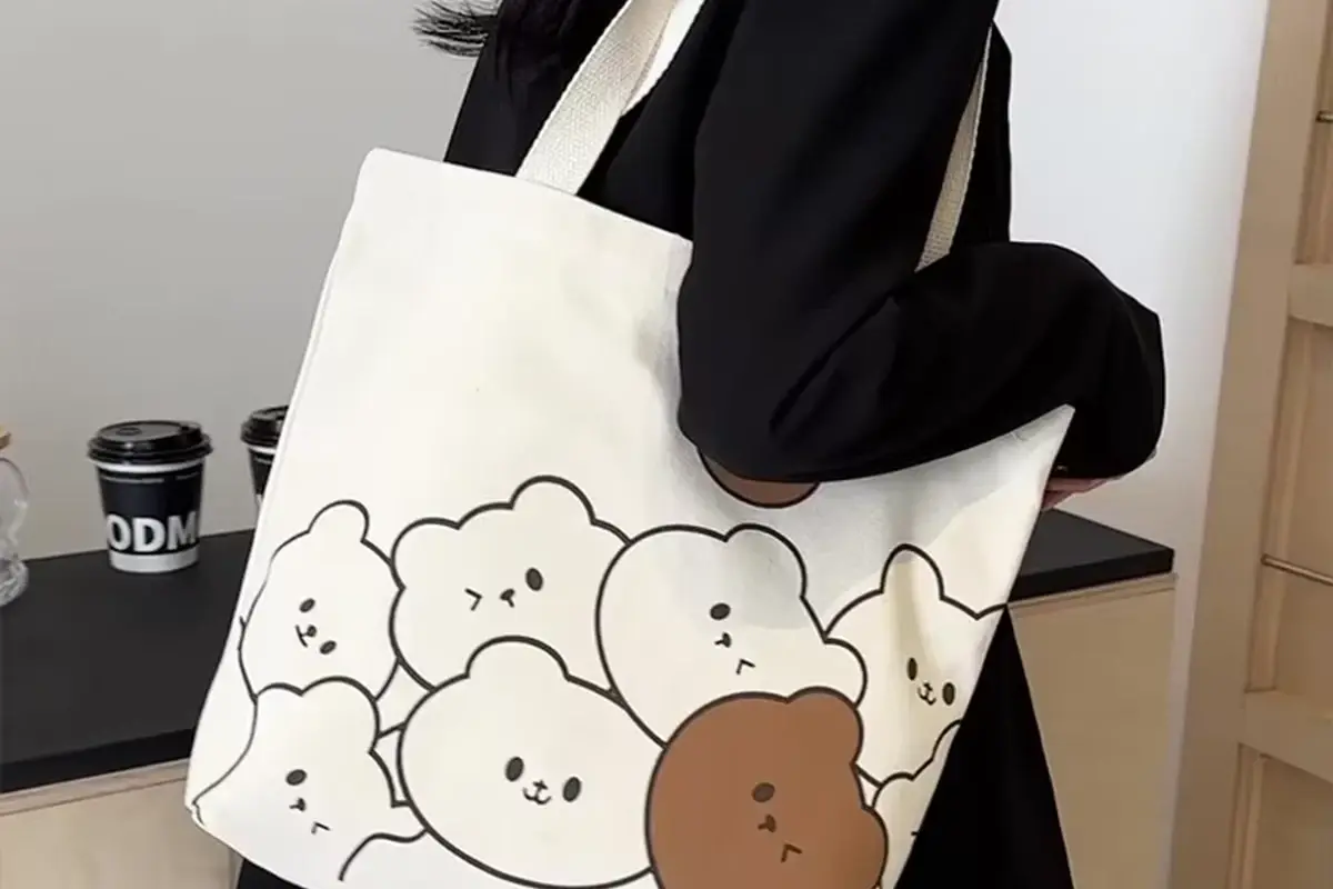 Printed cotton tote with long handles carried over the shoulder