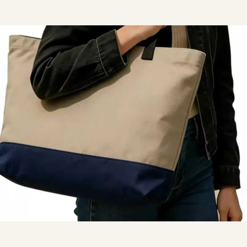 Large beige canvas tote with navy webbing handles and base