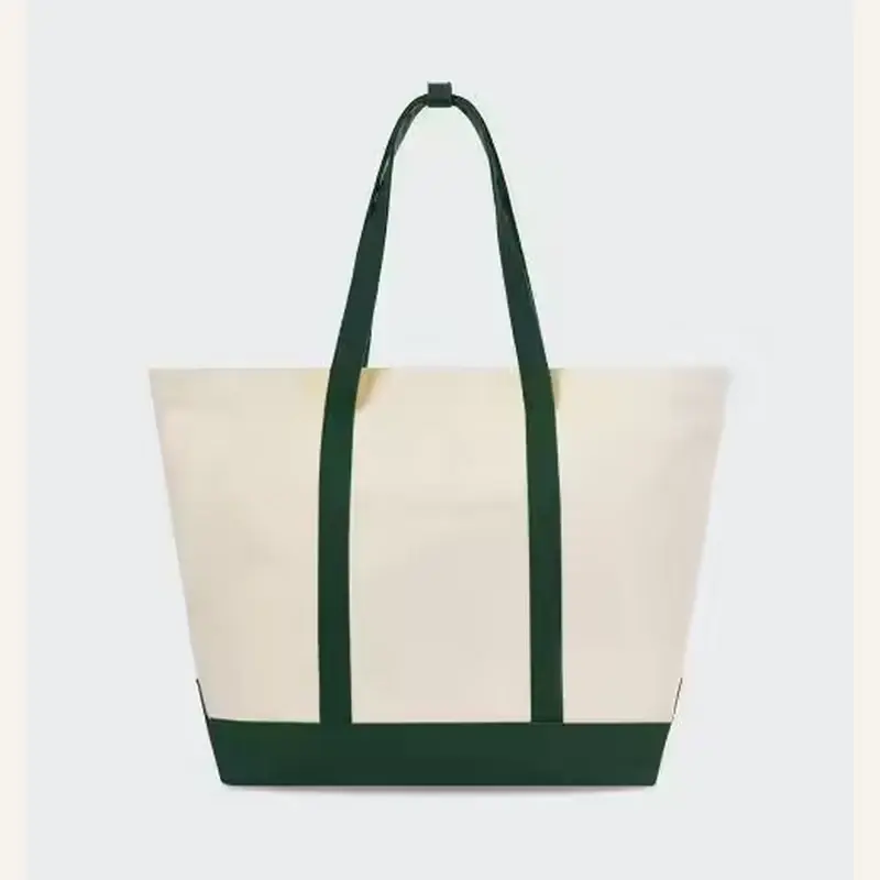 White gusseted tote bag with green webbing trim