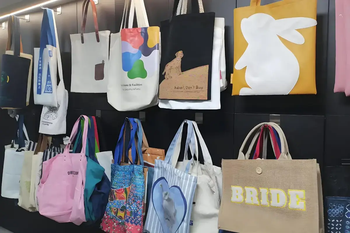 Colorful tote samples displayed for distributor style review