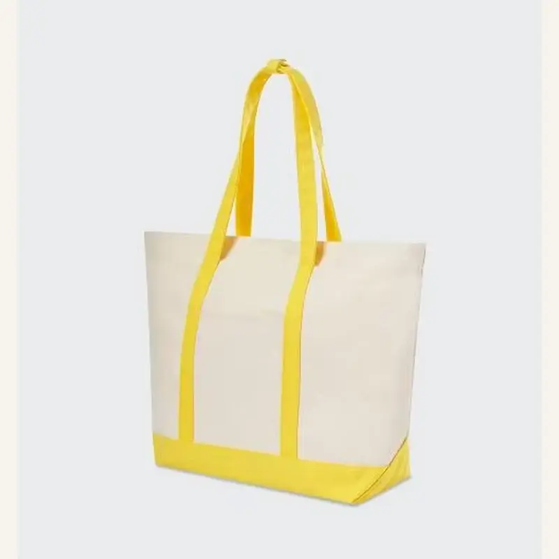 White gusseted tote bag with yellow webbing trim