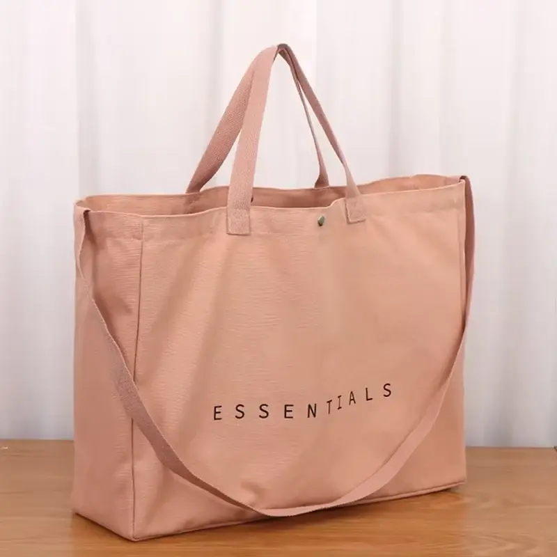 Pink gusseted canvas tote bag with a secure zipper top