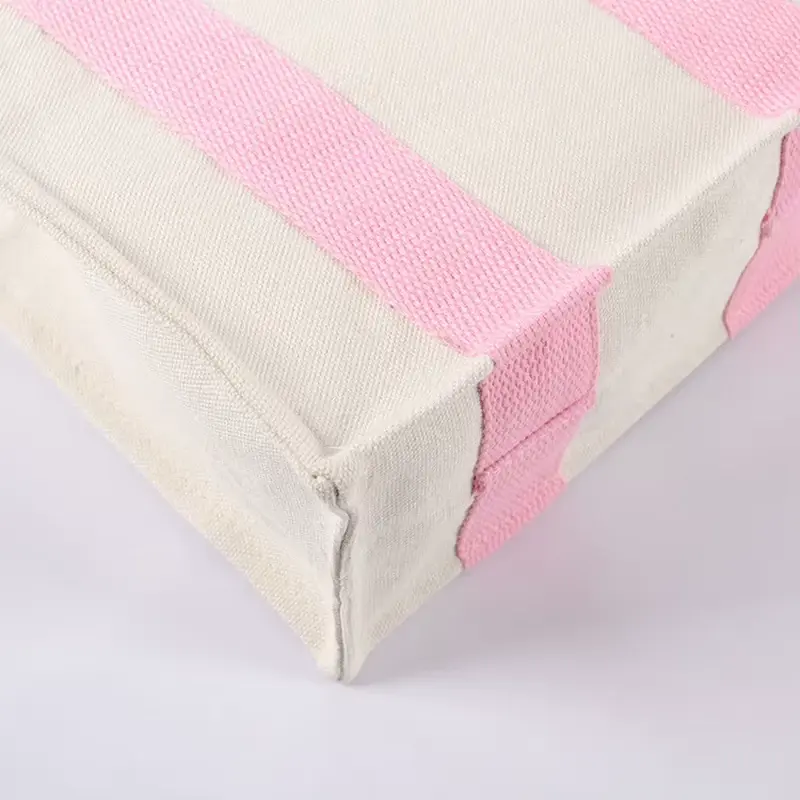 Boxed canvas gusset with pink webbing reinforcement