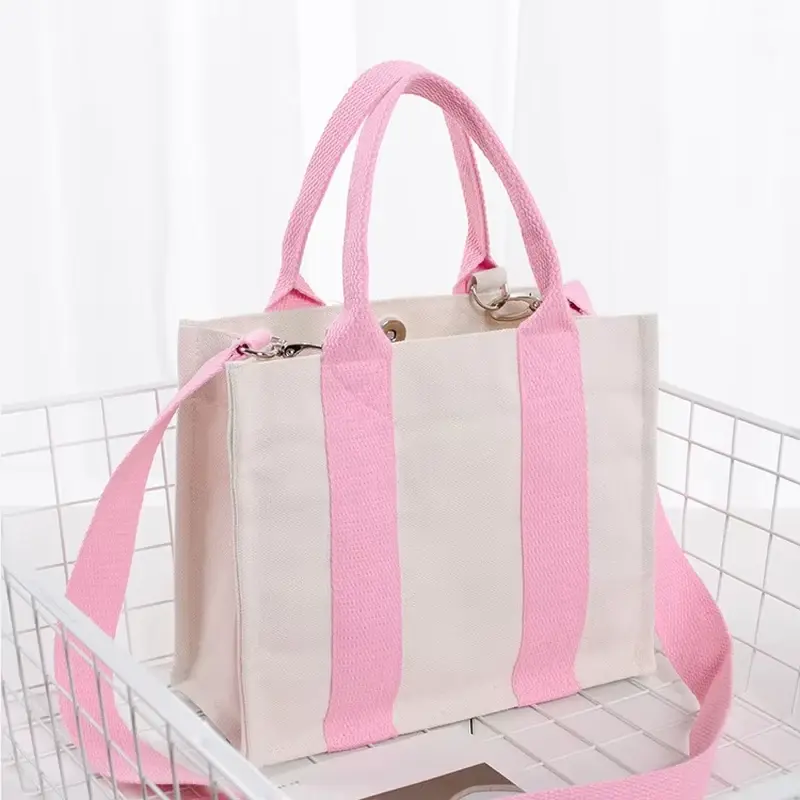 Pink and natural canvas zipper tote with a wide box gusset