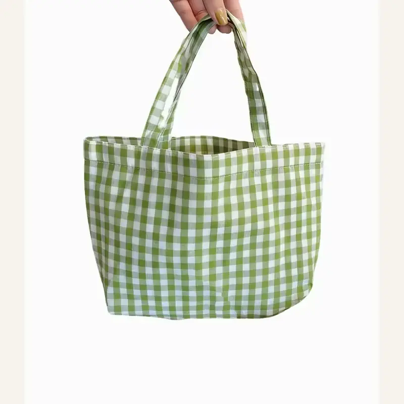 Green gingham canvas tote with a wide structured base