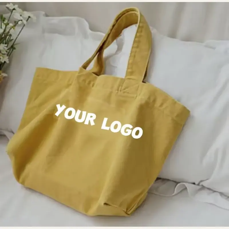 Mustard heavy canvas tote with short handles and a wide base