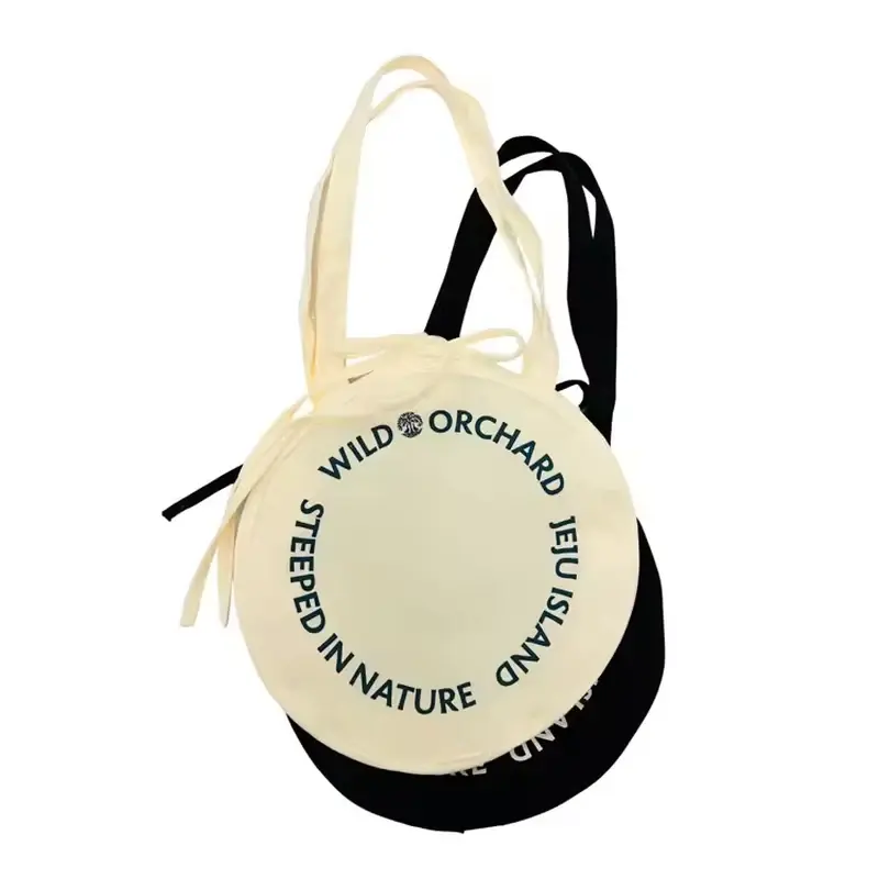 Natural round canvas tote with short contrasting handles