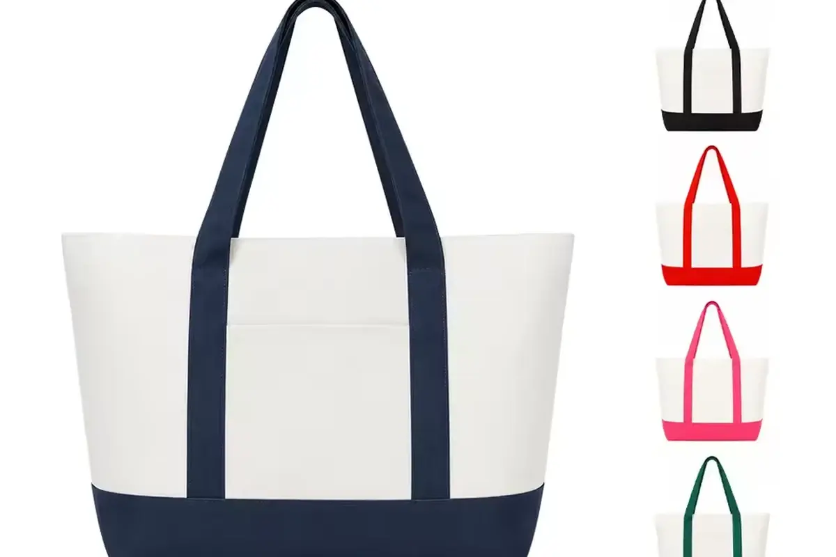 White canvas zipper tote with navy trim and a clear branding area