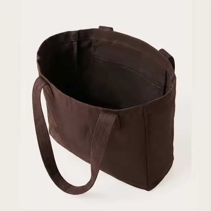 Open brown cotton shopping tote with a wide structured base