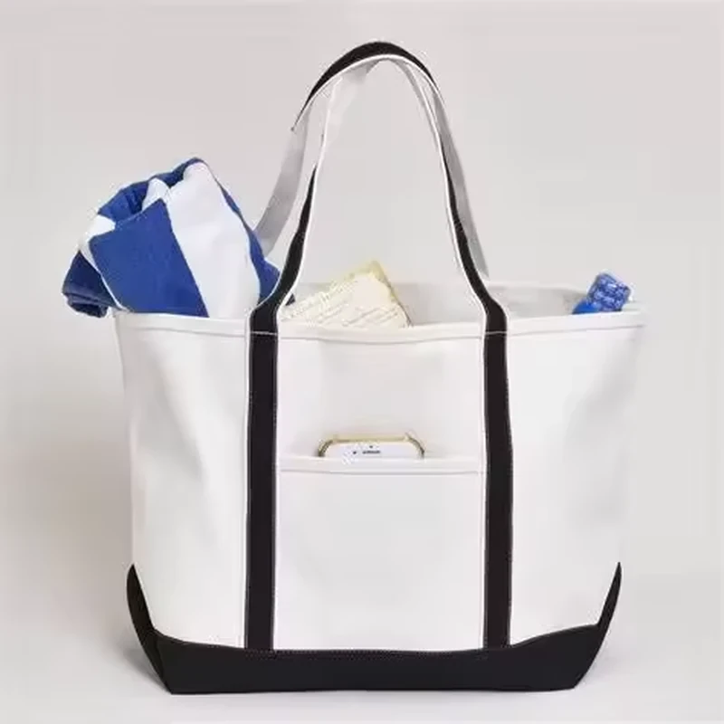 Natural canvas tote with a navy gusseted base and long handles