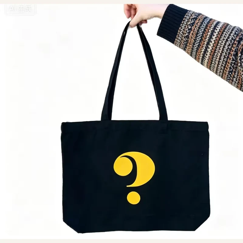 Black lightweight cotton tote with a yellow question mark and long handles