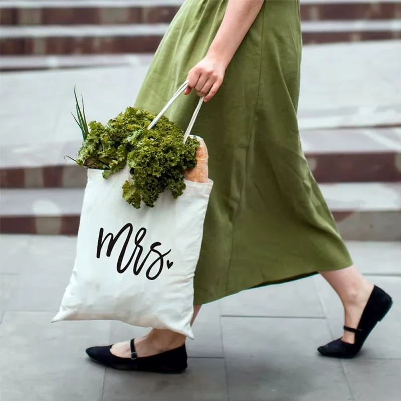 Natural cotton tote with black script print and long shoulder handles