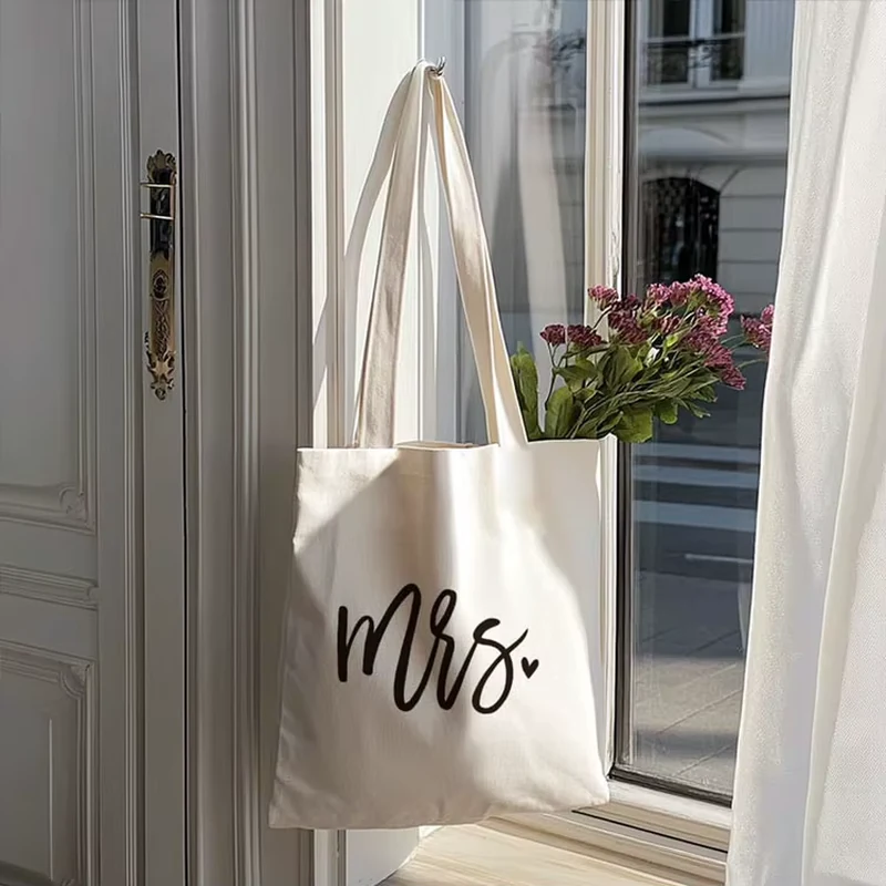 Natural long-handle cotton tote with black script artwork